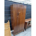 A SINGLE OAK WARDROBE