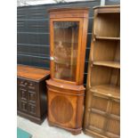 A YEW WOOD CORNER CABINET WITH LOWER DOOR AND UPPER GLAZED DOOR