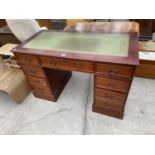 A REPRODUCTION KNEEHOLE DESK ENCLOSING NINE DRAWERS WITH INSET LEATHER TOP, 48x24"