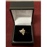 A DECORATIVE ABSTRACT DESIGN 18 CARAT GOLD DIAMOND CLUSTER RING 3.47G APPROXIMATELY 60 PTS SIZE: O