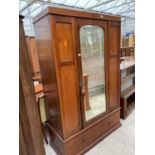 AN INLAID MAHOGANY WARDROBE WITH BEVEL EDGE MIRRORED DOOR AND LOWER DRAWER