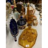 AN ASSORTMENT OF POTTERY AND COLOURED GLASSWARE