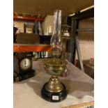A BRASS OIL LAMP WITH GLASS FUNNEL (HEIGHT APPROXIMATELY 55 CM)