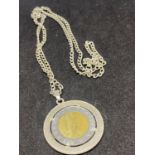 A SILVER NECKLACE MARKED 925 WITH A COIN IN A MOUNT