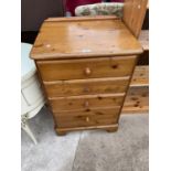 A MODERN PINE FOUR DRAWER CHEST, 23" WIDE