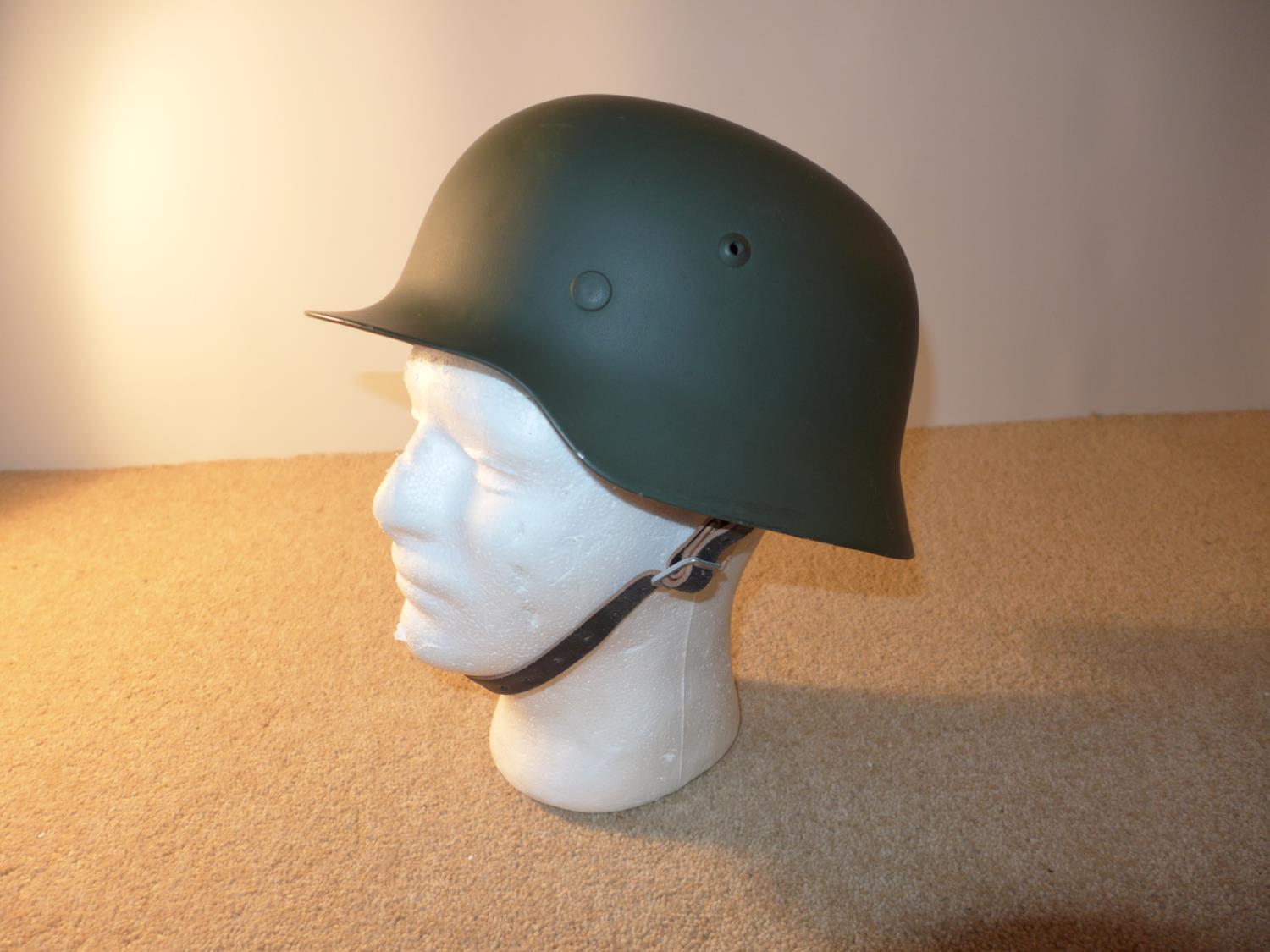 A GERMAN HELMET AND LINER LATE 20TH CENTURY
