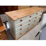 A MODERN PINE AND PAINTED CHEST OF FOUR SHORT AND SIX LONG DRAWERS, 63" WIDE
