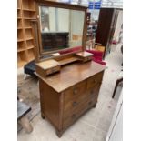 AN OAK ART NOUVEAU DRESSING CHEST OF TWO SHORT AND TWO LONG DRAWERS, THE MIRROR TOP ENCLOSING TWO