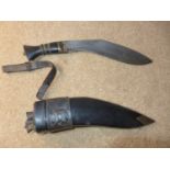 A KUKRI KNIFE, 21CM INCISED DECORATED BLADE, LEATHER SCABBARD AND TWO KARDA KNIVES