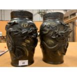 A PAIR OF ORIENTAL STYLE BRONZE VASES WITH DRAGON DESIGN