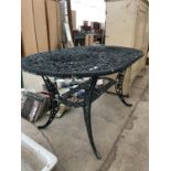 A CAST METAL FLORAL DESIGN OUTDOOR GARDEN TABLE