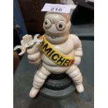 A CAST 'MICHELIN MAN' MONEY BOX