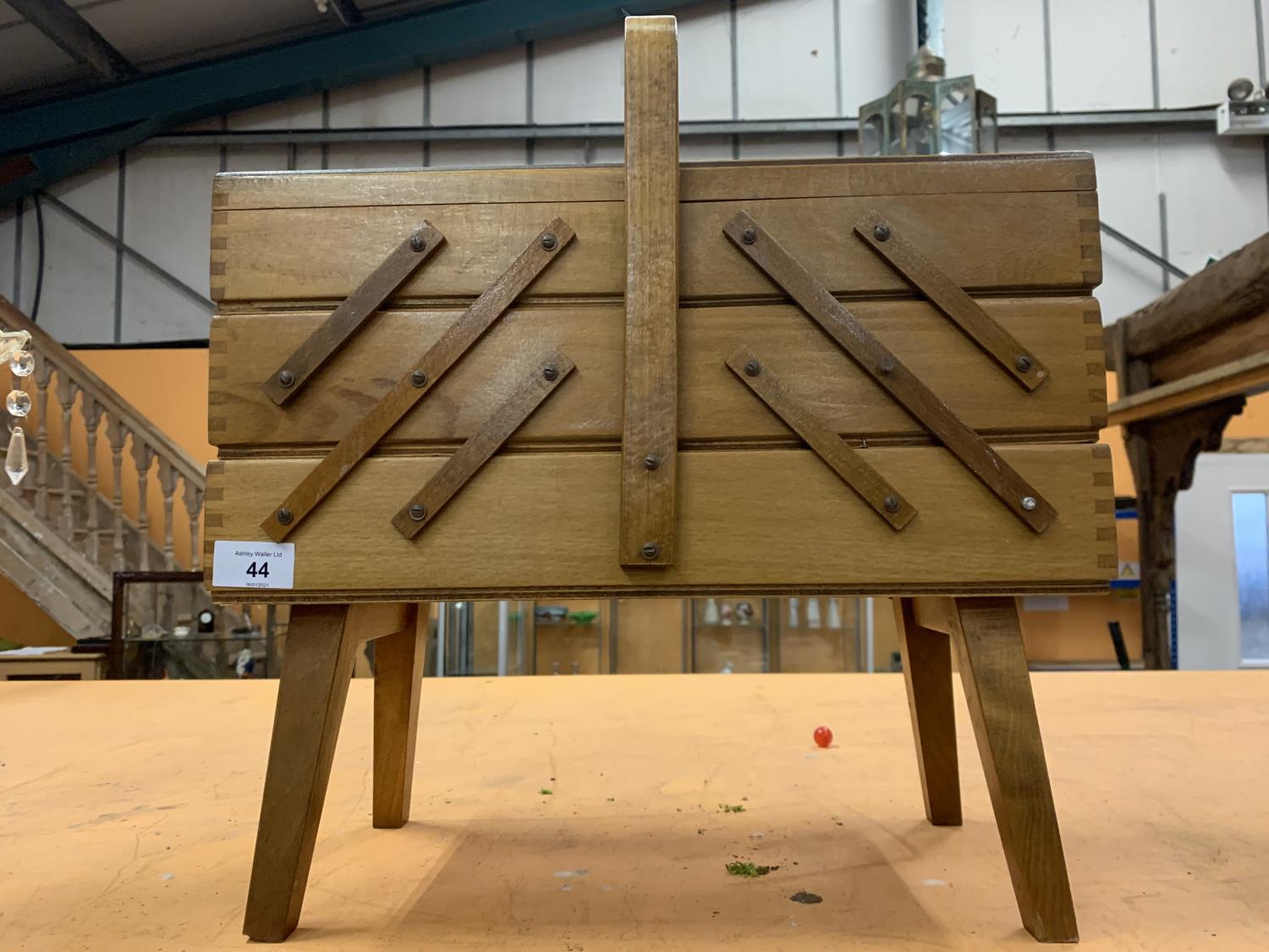 A VINTAGE WOODEN CANTILEVER SEWING BOX