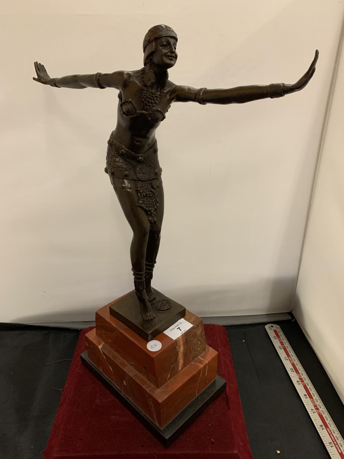 AN ART DECO BRONZE CHARLESTON DANCING FIGURE MOUNTED ON A MARBLE PLINTH AND SIGNED D H CHIPARUS