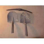 A WORLD WAR I RELIC BRITISH PICKAXE HEAD AND TWO SPADES ONE MARKED SPEAR AND JACKSON, REPUTEDLY