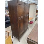 AN EARLY 20TH CENTURY OAK TWO DOOR GENTEMANS WARDROBE ON CABRIOLE LEGS, 48" WIDE