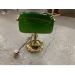 A BRASS BANKERS LAMP WITH ANGLED GREEN GLASS SHADE