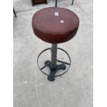 AN "ANDY THORNTON ORIGINAL" LEATHER TOP BAR STOOL ON CIRCULAR BASE WITH FOOT REST