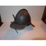 A COPY OF A 17TH CENTURY ENGLISH CIVIL WAR HELMET WITH SLIDING NASAL GUARD AND PLUME HOLDER