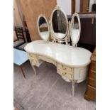 A MODERN CREAM AND GILT KIDNEY SHAPED DRESSING TABLE WITH TRIPLE MIRROR, 53" WIDE