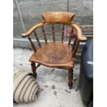 A VICTORIAN CAPTAIN'S CHAIR WITH TURNED SPINDLE UPRIGHTS AND SUPPORTS