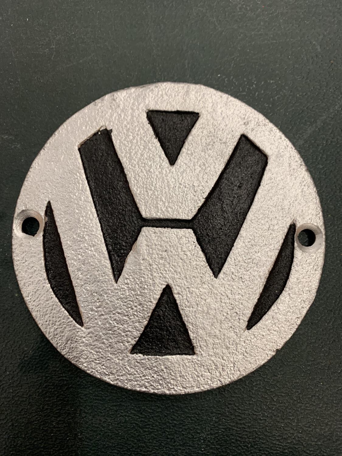 A METAL VW BADGE PLAQUE