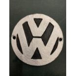 A METAL VW BADGE PLAQUE