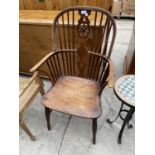 A 19TH CENTURY ELM SEATED WHEEL BACK WINDSOR ARMCHAIR