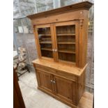 A VICTORIAN STYLE PINE KITCHEN CABINET WITH GLAZED TWO DOOR UPPER PORTION AND TWO CUPBOARDS TO THE