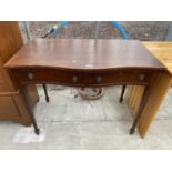 A 19TH CENTURY STYLE MAHOGANY SERPENTINE FRONTED SIDE-TABLE ON TAPERED LEGS AND SPADE FEET, 39" WIDE