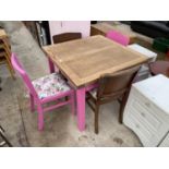 AN OAK DRAW-LEAF DINING TABLE WITH PINK PAINTED BASE, TOGETHER WITH FOUR CHAIRS, TWO PAINTED PINK TO