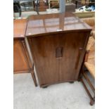 A 1950s WALNUT TV CABINET