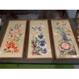 THREE FRAMED ORNATE EMBROIDERED PICTURES OF EXOTIC BIRDS AND FLOWERS