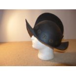 A MORION HELMET WITH BRASS DECORATION, LENGTH 38CM, HEIGHT 28CM, WITH PLUME SOCKET