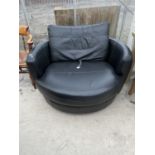 A MODERN BLACK LEATHER CIRCULAR SWIVEL SNUGGLE ARMCHAIR