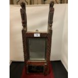 AN ORNATE WOODEN WALL HANGING TRIBAL MIRROR WITH UNDERNEATH COMPARTMENT