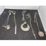 FIVE SILVER NECKLACES WITH PENDANTS TO INCLUDE A CROSS, DISC, FUNNEL, SPIDERS WEB AND BAR MARKED 925