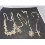 FOUR SILVER NECKLACES ALL MARKED WITH PENDANTS TO INCLUDE A SPIDER WITH WEB, CLOWN, CROSS ETC