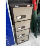 A METAL FOUR DRAWER FILING CABINET