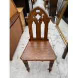 A VICTORIAN OAK GOTHIC HALL CHAIR