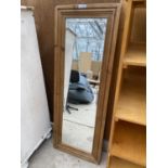 A WOODEN FRAMED WALL MIRROR (H:138CM W:52CM)