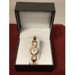 A PINK METAL LADIES WRIST WATCH BOXED AND NEW