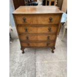 A REPRODUCTION WALNUT CHEST OF FOUR DRAWERS ON CABRIOLE LEGS, 24" WIDE