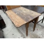 A VICTORIAN PINE DROP-LEAF KITCHEN TABLE