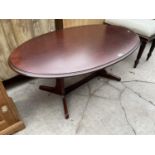 AN OVAL MAHOGANY COFFEE TABLE