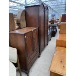 A MID 20TH CENTURY WALNUT ARCHED TOP DOUBLE WARDROBE AND MATCHING TALLBOY, ON CABRIOLE LEGS