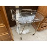 A RETRO TWO TIER DINNER TROLLEY FRAMED WITH TUBULAR METAL, TOGETHER WITH TWO GLASS SHELVES