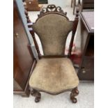 A VICTORIAN CARVED WALNUT NURSING CHAIR