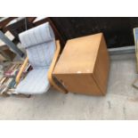 A LOCKABLE WOODEN STORAGE CUPBOARD WITH AN IKEA POANG STYLE CHAIR