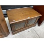 AN OLD CHARM OAK TV CABINET WITH TWO LEAD GLAZED DOORS